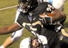 STAFF PHOTO DAVID FRANK DEMPSEY -- Bentonville running back Tearris Wallace gains yards before being dragged down by Har-BerÕs Hunter Patrick, underneath at Tiger Stadium in Bentonville Friday, Nov. 4, 2011. 