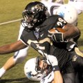 STAFF PHOTO DAVID FRANK DEMPSEY -- Bentonville running back Tearris Wallace gains yards before being...