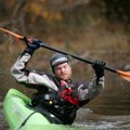 Ben Hodgin of Rogers demonstrates rolling techniques in a small kayak at a previous Lincoln Lake Out...