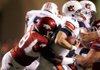 Defensive end Lonnie Gosha sacks Auburn quarterback Barrett Trotter in Arkansas’ 38-14 victory in Fayetteville. 