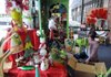 Kristen Thompson, co-owner of Whimsy Whoo, puts out stock Wednesday at the store in Springdale. Sales have been good so far at the store, and owners expect a strong holiday.
