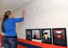 Daniela Campos, 15, works on the newly established Wall of Honor in the history and art department’s hallway at Southwest Junior High School in Springdale. The mural, which is expected to be completed by the end of the current semester, is dedicated to alumni of the school who have served in the military. Current students with family members who did not go to Southwest are also being honored.
