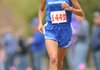 Maggie Montoya, Rogers High, leads Lady Mounties to another win at the state cross country championships in Harrison.
