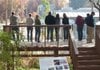  
Visitors view the Crystal Bridges Museum of American Art from the observation deck on the Crystal Bridges Trail in Bentonville on Saturday, Nov. 5, 2011.