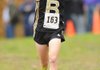 STAFF PHOTO ANDY SHUPE
Bentonville's Will Aechbacher celebrates as he nears the finish line Saturday, Nov. 5, 2011, during the state cross country championships in Harrison.