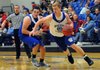 Zach Jones, right, drives past Grant Holman on Tuesday during the Blue-White scrimmage at Rogers High.