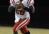 Deon Clay, Farmington’s senior quarterback, rolls out looking to pass in a game played earlier this season. Farmington will host Dumas in the first round of the Class 4A state playoffs Friday night at Allen Holland Field.