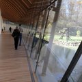Visitors walk across the gallery bridge Friday, Nov. 11, 2011, during the opening day at the Crystal...
