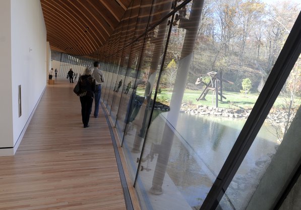 
                               
                                  Photo by Justin Wedgworth&mdash;
                               
                           
                           Visitors walk across the gallery bridge Friday, Nov. 11, 2011, during the opening day at the Crystal Bridges Museum of American Art in Bentonville.