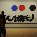 Ben and Danielle May, of Bella Vista, walk past Adolph Gottlieb's "Trinity" on Friday, Nov. 11, 2011...