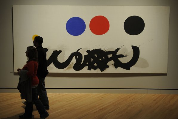 
                               
                                  Photo by Justin Wedgworth&mdash;
                               
                           
                           Ben and Danielle May, of Bella Vista, walk past Adolph Gottlieb's "Trinity" on Friday, Nov. 11, 2011, during the opening day at the Crystal Bridges Museum of American Art in Bentonville.