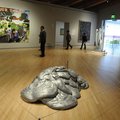 Visitors look at art displays Friday, Nov. 11, 2011, during the opening day at the Crystal Bridges M...