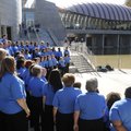 The Walmart Associate National Choir sings Friday, Nov. 11, 2011, during the opening day at the Crys...