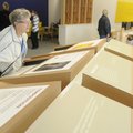 Gwen Janssen, of Bella Vista, looks over one of the interactive displays Friday, Nov. 11, 2011, duri...