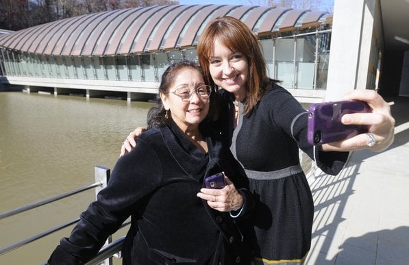 
                               
                                  Photo by Justin Wedgworth&mdash;
                               
                           
                           Anita Posey, right, takes a photograph with her mother, Helena Pittman, both of Bentonville, during opening day at the Crystal Bridges Museum of American Art in Bentonville. Both said they had been looking forward to the museum's opening.