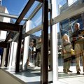 Bruce (right) and Linda Wilkinson of Rogers wait for their timed entry during the grand opening of C...