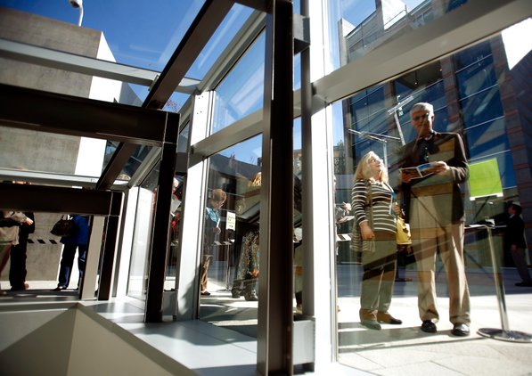 
                               
                                  Photo by Jason Ivester&mdash;
                               
                           
                           Bruce (right) and Linda Wilkinson of Rogers wait for their timed entry during the grand opening of Crystal Bridges Museum of American Art in Bentonville on Friday, Nov. 11, 2011.