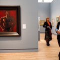 Russell and Patti McGill, both of Rogers, look over the painting "Madawaska-Acadian Light-Heavy" (oi...