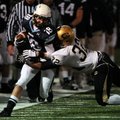 STAFF PHOTO ANTHONY REYES - Springdale Har-Ber senior Travis Tollett (18) is pushes out of bounds by...