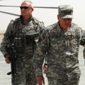 Chief Warrant Officer Mark Howell of Rogers, left, is shown in Iraq with Gen. David Petraeus in this...
