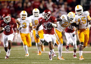  
UA vs Tennessee football
Arkansas running back Dennis Johnson breaks through the Tennessee defense for a touchdown run during the second quarter at Donald W. Reynolds Razorback Stadium in Fayetteville on Saturday, Nov. 12, 2011.