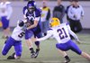 Tyler Tuck, Fayetteville senior tight end, makes a catch behind Little Rock Catholic junior cornerback Jack Harris as sophomore Matthew Strack closes in on the play Friday at Harmon Field. Go to photos.nwaonline.com to see more photos.
