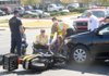 Central Emergency Medical Service personnel attend to a motorist Nov. 1 after her scooter was struck by a car on South School Avenue in Fayetteville. Central EMS, the ambulance service that covers much of Washington County, is considering increasing its rates to transport patients during emergency situations.
