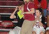 Heather Hunsucker, Springdale’s new girls basketball coach, shouts instructions to the Lady Bulldogs from the sidelines in a game against Lincoln in Springdale on Saturday.