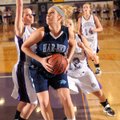 Har-Ber junior post Caroline Eubanks, center, moves to score as Fayetteville seniors Clair Childers,...
