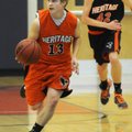 Heritage High’s Garrett Macy starts a fast break during the Blue-Orange scrimmage at War Eagle
Aren...