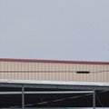 Noe Marquez, right, signals to others Monday as he works with Mario Nava on the construction of a ne...