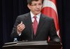 Turkish Foreign Minister Ahmet Davutoglu speaks to reporters Monday in Ankara after Turkey, on Sunday, summoned a Syrian diplomat to protest a night of attacks on its diplomatic missions in Damascus and other cities. 