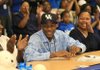  Arkansas Democrat-Gazette/STATON BREIDENTHAL 11/15/11
Archie Goodwin (middle) wears a Kentucky hat as his mother, Melesha Humphry (right), and father, Archie Goodwin, Jr.,  applaud Tuesday morning at Sylvan Hills High School after Goodwin signed a letter of intent to play basketball at the University of Kentucky.