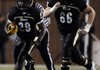 Alex Horton, Bentonville wide receiver, hauls in a 62-yard touchdown pass in front of West Memphis’ Calman Clark during the third quarter of the Tigers’ game Friday against the Blue Devils at Tiger Stadium in Bentonville. For more photos go to photos.nwaonline.com.
