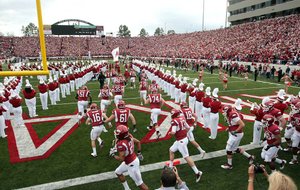  11/19/11
Arkansas Democrat-Gazette/STEPHEN B. THORNTON
Arkansass Razorbacks runs out onto the field at the start of  their  game Saturday against Mississippi State at War Memorial Stadium.