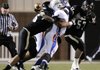 Nick Fernandez, left, a Bentonville linebacker, forces West Memphis quarterback Jerome Roberts, 2, to fumble the ball on a sack during the second quarter of the Tigers’ game Friday against the Blue Devils at Tiger Stadium in Bentonville.
