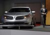 Chief designer Max Wolff stands by the 2013 Lincoln MKS during its debut at the Los Angeles Auto Show last week. 