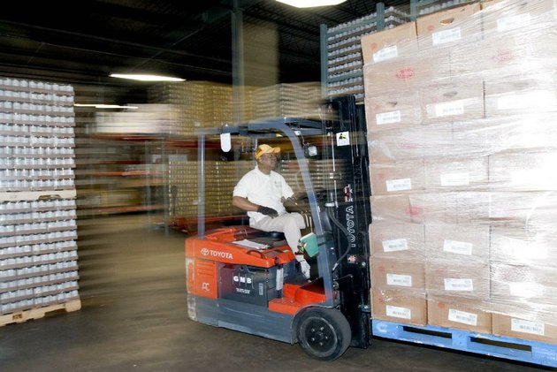 arkansas-democrat-gazettekaren-e-segrave-112211-john-fred-brown-an-employee-with-the-arkansas-rice-depot-moves-a-pallet-of-family-packs-of-chicken-drumsticks-that-was-donated-by-tyson-foods-on-tuesday-tyson-foods-inc-donated-30000-of-chicken-in-an-effort-to-fight-hunger-in-arkansas