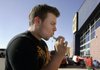 Arkansas Democrat-Gazette/DAVID GOTTSCHALK

Jesus Marquez, 19, of Springdale, brushes his teeth in front of the Best Buy in Fayetteville Thursday afternoon.
Marquez, who arrived  Wednesday night, was waiting to purchase a 42" television which was part of the Black Friday sale for the store. The store opened for Black Friday sales at 12:00 a.m. today.