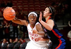 Arkansas senior C’eira Ricketts (left) tries to get past Texas-Arlington’s Sabreena DeNure during the during one of five games the Razorbacks played between No. 11 and Nov. 20. The Thanksgiving holiday was a welcome respite, said Coach Tom Collen. “ [The break] has allowed us to get back to working on ourselves a little bit instead of always preparing for our opponents in the next game.” 