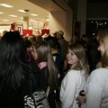Black Friday shoppers wait outside a store Friday morning.