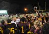 Lake Hamilton Coach Jerry Clay (left center) celebrates with his team following the Wolves’ 23-21 victory over Pine Bluff on Friday. The Wolves will face El Dorado for the Class 6A championship next week. 
