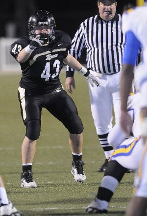STAFF PHOTO J.S. WEDGEWORTH -- Bentonville's John Donald reads the offense Friday, Nov. 25, 2011, while hosting North Little Rock at Tiger Stadium.