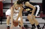 Calli Berna of Arkansas steals the ball from Grambling State’s Tonishea Mack Friday at Bud Walton Arena in Fayetteville.
