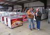 Potential bidders look over listings of the different items for sale during a bankruptcy auction Nov. 30 at the Yarnell's plant in Searcy.