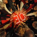 Candlelight vigil participants at St. Paul’s Episcopal Church in Fayettteville join together Thursda...