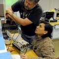 Benny Burk, left, and Gary Sanchez, both students at Northwest Technical Institute, begin to remove ...