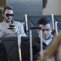 Matt James texts his girlfriend Wednesday while waiting for a flight at Northwest Arkansas Regional ...