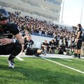 TIGERS’ ROAR SILENCED Bentonville senior Colten Folck, left, reacts Saturday after the Tigers lost, ...