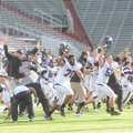 Fayetteville players and coaches rush the field Saturday after the Bulldogs’ defeated Bentonville, 2...